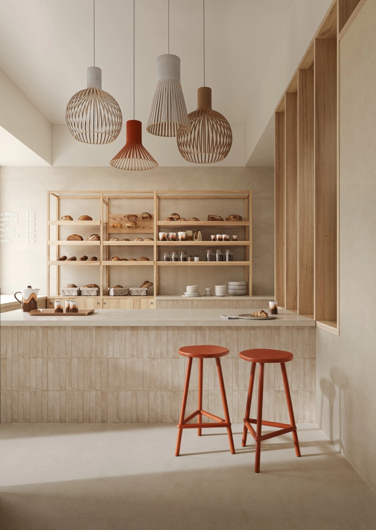 Płytki Marazzi Grande Concrete Look efekt beton w salonie z otwartą kuchnią