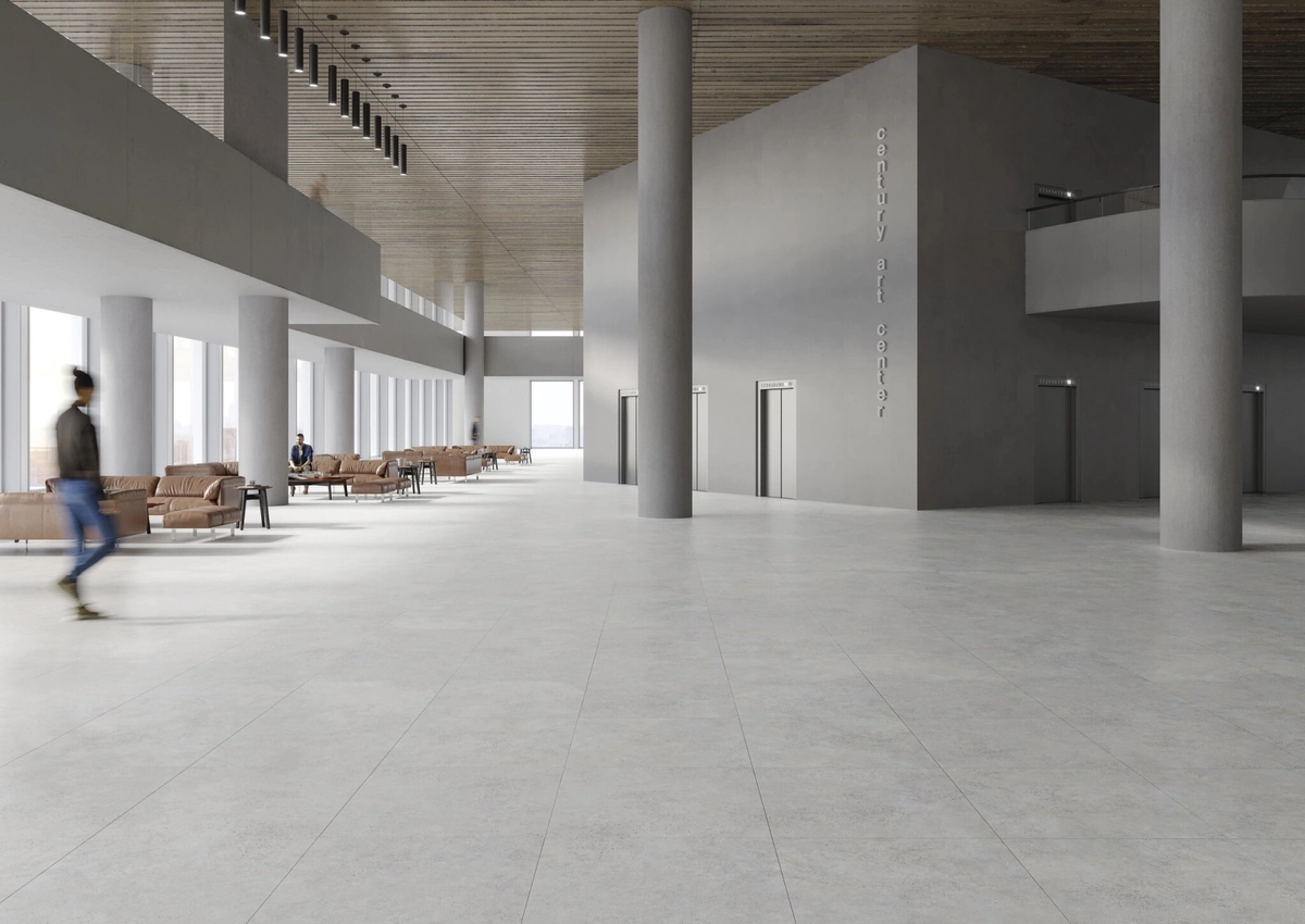 Gres Cifre PULSAR efekt beton - aranzacja w przestronnym holu