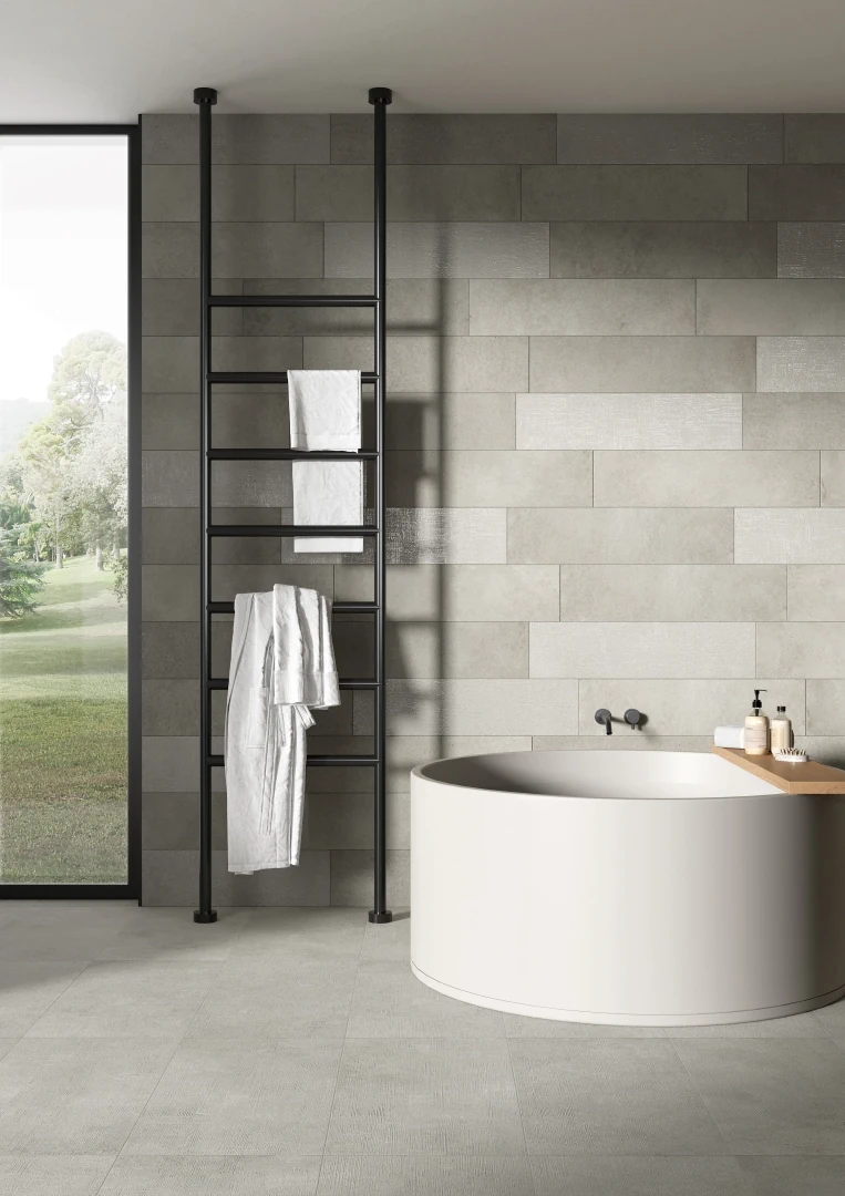 Gres Rondine LOFT efekt beton - aranzacja w strefie dziennej z duzymi przeszkleniami
